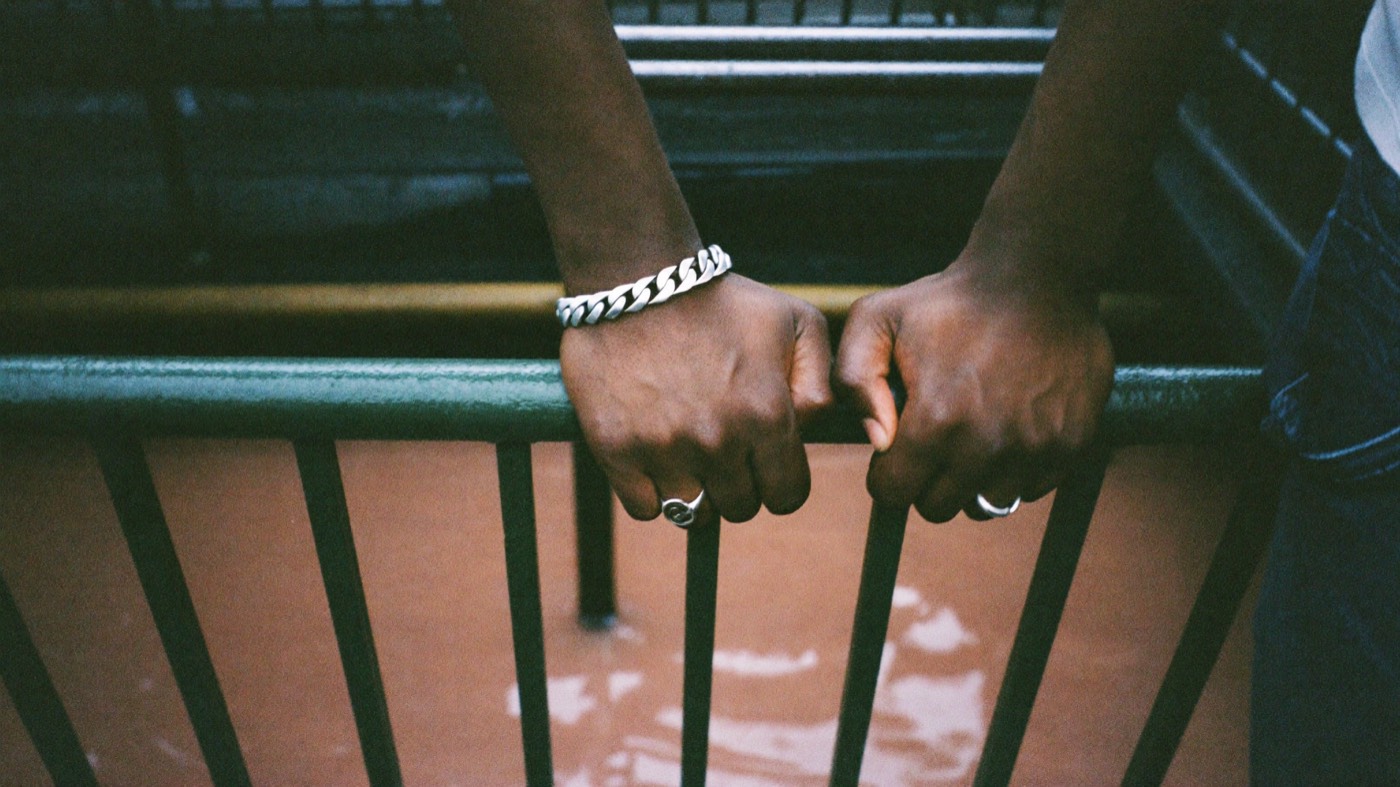 Chain and rings on a subway railing