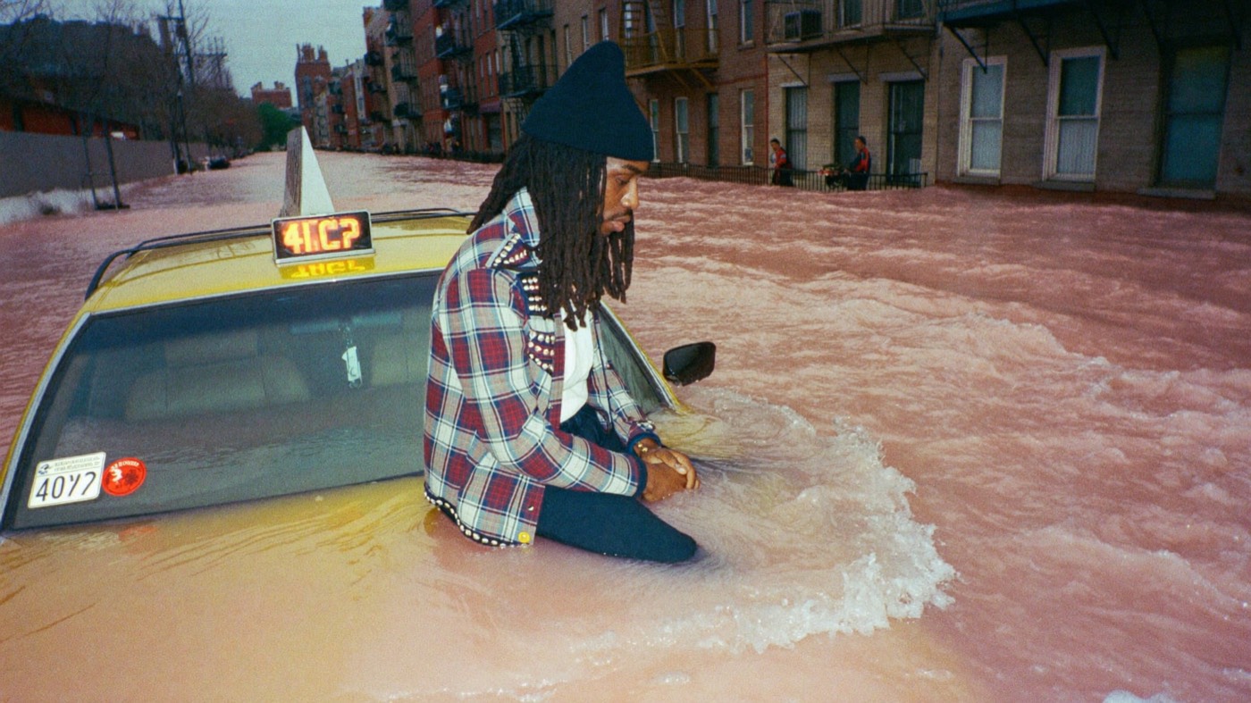 Sitting on a taxi in the flood